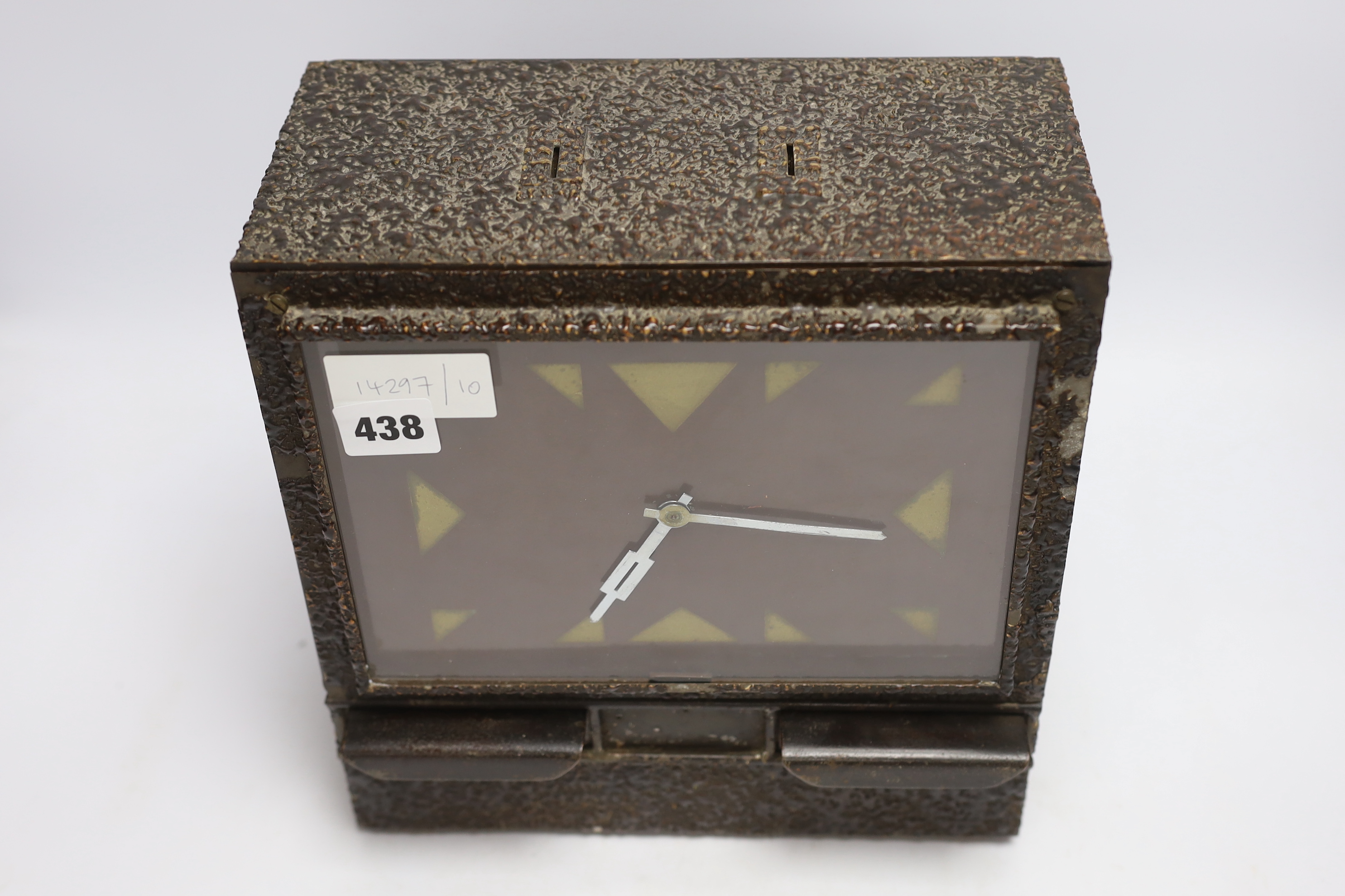 A coin operated metal clockwork timepiece cigarette dispenser, 29cm